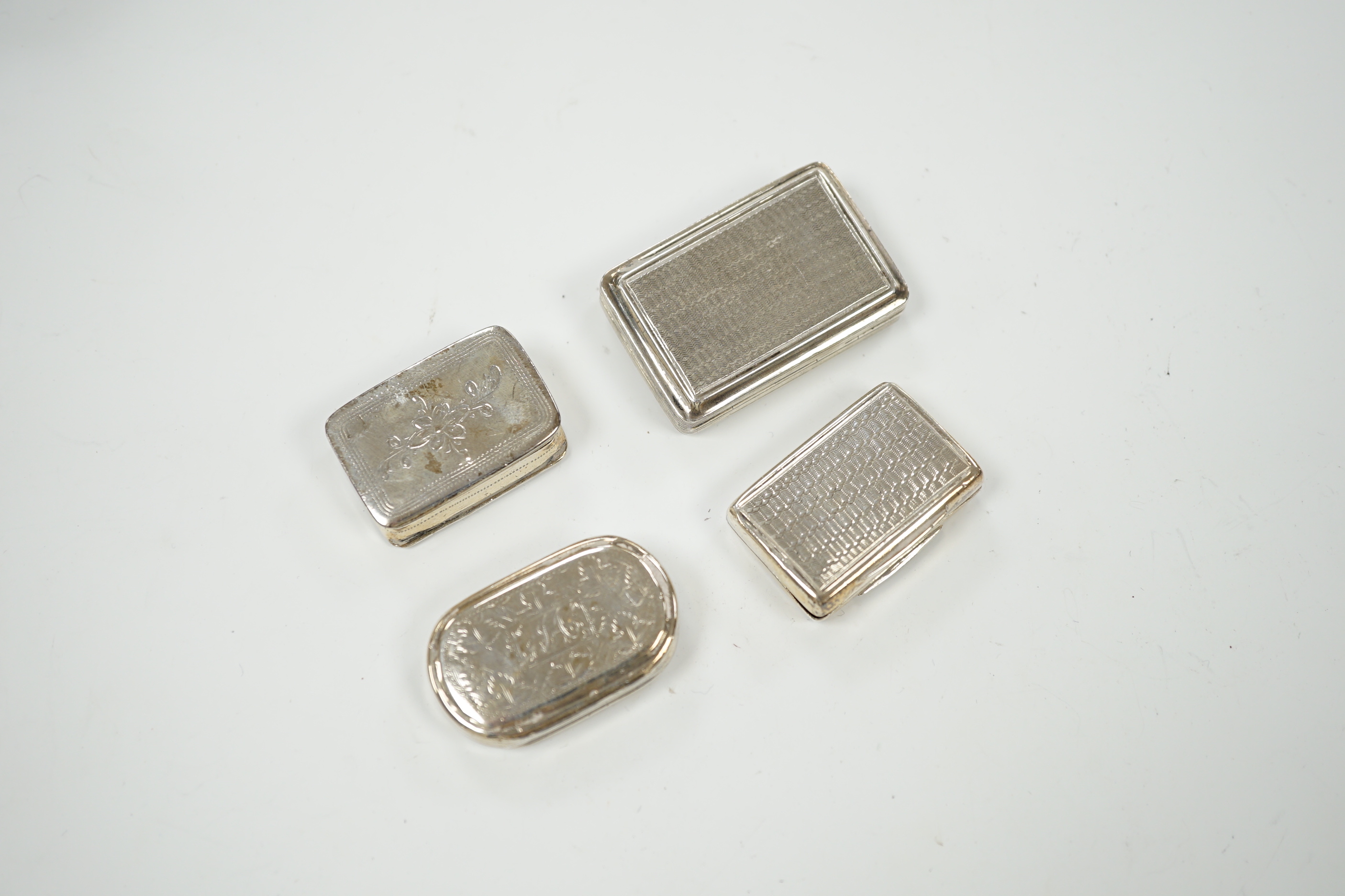 Four assorted 19th century silver vinaigrettes, including Joseph Wilmore, Birmingham, 1831, with engraved lattice work decoration, 32mm.